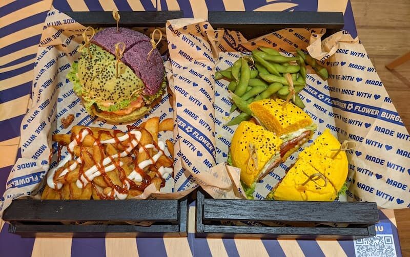 a tray containing Flower Burgers and sides